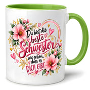 Herzbotschaft Schwester Tasse – Du bist die beste Schwester, wie schön dass es dich gibt – Kaffeetasse 330 ml mit rosa Blumen und Herzen – Geschenk für Schwester zum Geburtstag, Weihnachten, als Dankeschön oder kleine Aufmerksamkeit