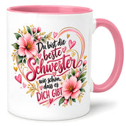Herzbotschaft Schwester Tasse – Du bist die beste Schwester, wie schön dass es dich gibt – Kaffeetasse 330 ml mit rosa Blumen und Herzen – Geschenk für Schwester zum Geburtstag, Weihnachten, als Dankeschön oder kleine Aufmerksamkeit