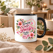 Herzbotschaft Schwester Tasse – Du bist die beste Schwester, wie schön dass es dich gibt – Kaffeetasse 330 ml mit rosa Blumen und Herzen – Geschenk für Schwester zum Geburtstag, Weihnachten, als Dankeschön oder kleine Aufmerksamkeit