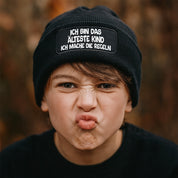 Beanie Strickmütze mit Spruch | Ich bin das älteste Kind - Für mich gelten die Regeln nicht! | schwarz | Angenehm weich | Onesize